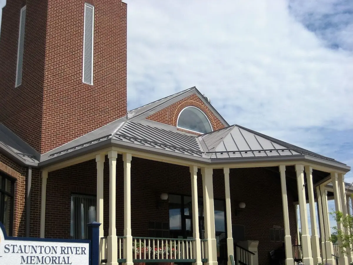 Skilled roofing craftsmen working on a residential roof in Downtown Watertown